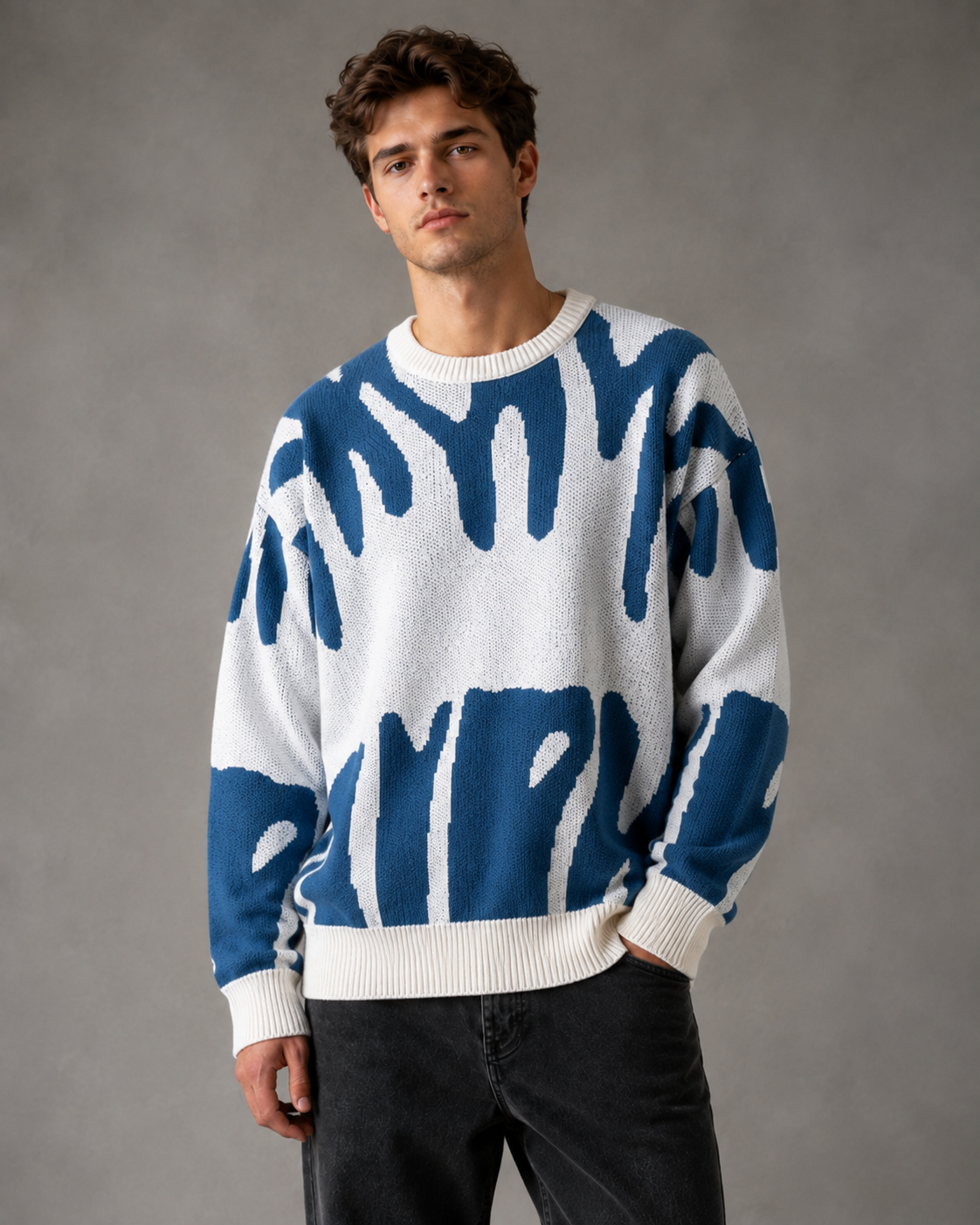 Maglione da uomo in maglia con motivo astratto e spalle scese