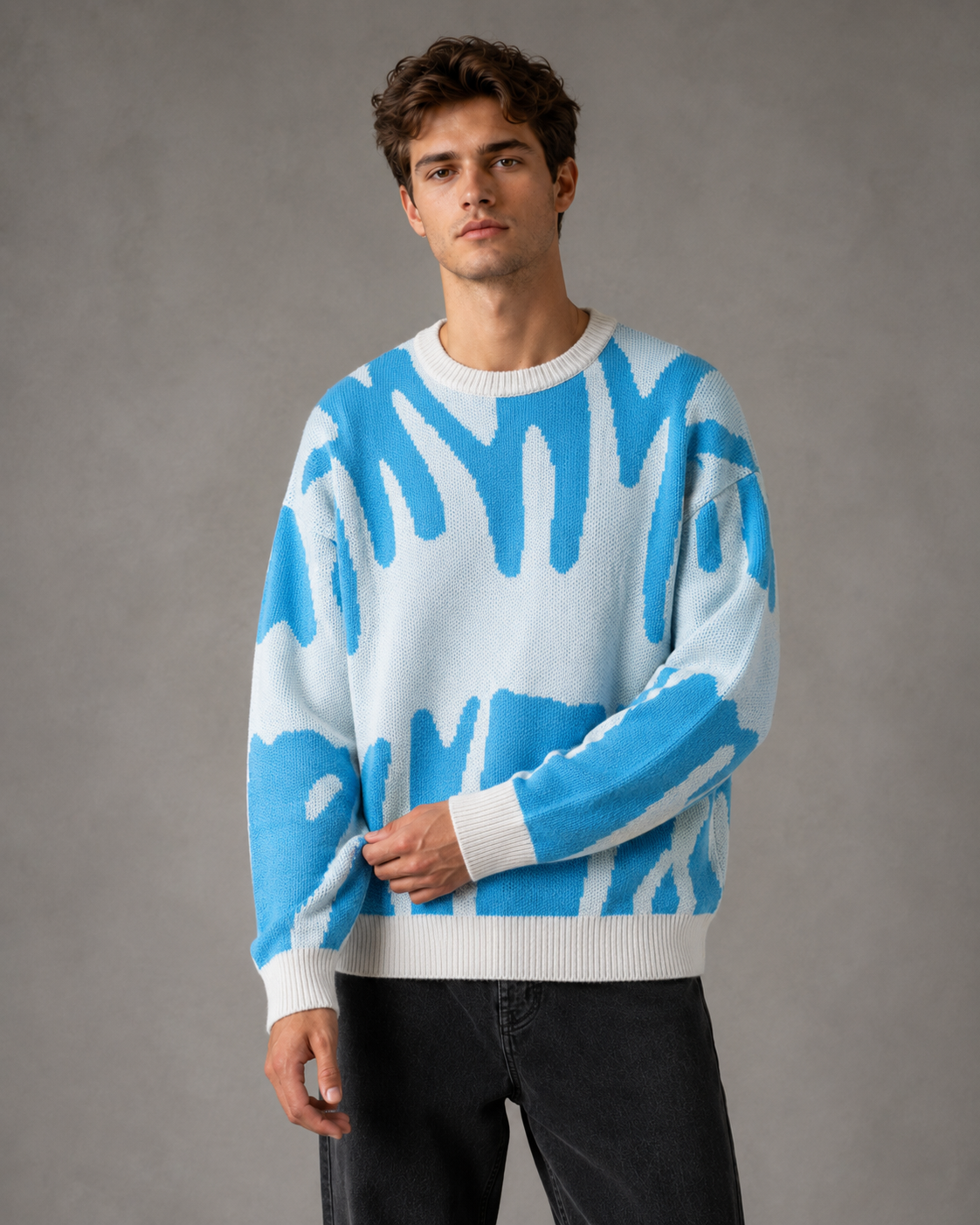 Maglione da uomo in maglia con motivo astratto e spalle scese